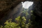 Sunlight Through A Cave Hole In Thailand Stock Photo