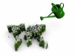 Watering Can And Green Earth Stock Photo