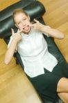 Woman Lying On Chaise Longue Stock Photo