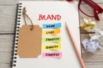 Brand Marketing Concept With Brand Tag On Notebook Stock Photo