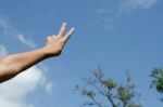 Hand With Two Fingers Up In The Peace Or Victory Symbol Stock Photo