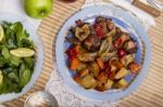 Oven Baked Meat With Potatoes, And Watercress Salad Stock Photo