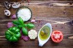 The Ingredients For Homemade Pizza On Shabby Wooden Background Stock Photo