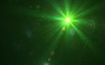 Abstract Green Lens Flare Light Over Black Background Stock Photo