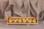 Gold Easter Egg  In Wooden Shelf Stock Photo