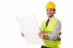 Male Construction Worker Holding Blueprint Stock Photo