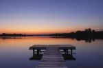 Lake Pier At Sunset Stock Photo