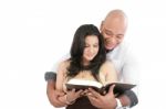 Couple Reading Book Stock Photo