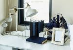 Work Table With Lamp,pencil, Books In A Home Stock Photo