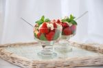 Strawberries With Biscuit Pieces With Mint Whipped Cream Under Stock Photo