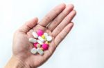 Top View Of The Pills On The Hand And White Background, A Hand Hold The Pills And Drug Stock Photo