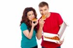 Young Couple Eating Pizza Stock Photo