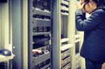 Man Fix Server Network In Data Center Room Stock Photo