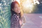 Beautiful Asian Younger Woman Laughing With Happiness Emotion And Sun Light Behind Stock Photo