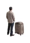 Back Of Young Man Standing With Big Suit Case Stock Photo