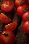 Organic Fresh Cherry Tomatoes On Wooden Background Stock Photo