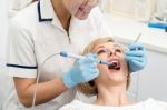 Woman Patient Undergoing A Dental Check Stock Photo