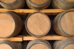 Horizontal Wooden Wine Barrels In Cellar Shelf Stock Photo