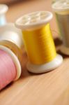 Yellow Thread On Wood Table Shallow Depth Of Field (soft Focus) Stock Photo