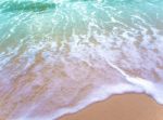 Bubble Of Sea Wave On The Beach Stock Photo