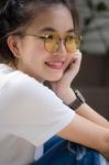 Portrait Of Thai Chinese Adult Glasses Beautiful Girl Denim Blue Bag Relax And Smile Stock Photo