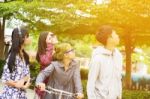 Group Of Asian Teenager Walking In The Park  Stock Photo