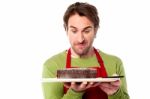 Male Chef Holding Yummy Chocolate Cake Stock Photo