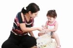 Mother Teaching To Her Daughter Stock Photo