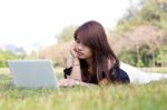 Asian Young Pretty Woman With Laptop Stock Photo