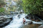 The Man Standing At Mae Ya Waterwall Stock Photo