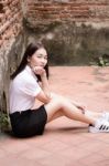 Thai Adult Student University Uniform Beautiful Girl Relax And Smile Stock Photo