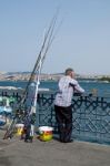 Istanbul, Turkey - May 24 : View Of A Man Fishing In Istanbul Turkey On May 24, 2018. One Unidentified Man Stock Photo