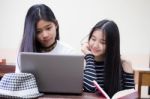 Two Asia Thai High School Student Uniform Best Friends Beautiful Girl Using Her Laptop Stock Photo