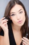 Woman Applying Mascara Stock Photo