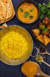 Indian Pilau Rice In Balti Dish Served With Chicken Tikka Masala Stock Photo