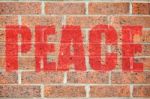 Old Brick Wall Texture With Peace Inscription Stock Photo