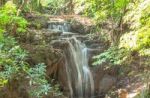 The Water Flowing Over Rocks And Trees Down A Waterfall At Huay Mae Khamin Waterfall National Park ,kanchana Buri In Thailand Stock Photo