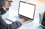 Businessman Working Laptop While Sitting At The Desk, Blurred Ba Stock Photo