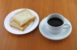 Bread Dish And Coffee On Wooden Table Stock Photo