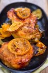 Delicious Baked Chicken Thighs With Lemon Slices, Onion And Zucchini Stock Photo