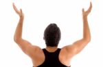 Back Pose Of Man With Raised Arms Stock Photo