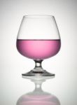 Pink Wine In Brandy Glass Stock Photo