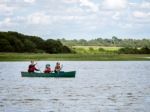 People Canoeing On The River Alde Stock Photo