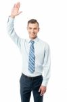 Business Execuitve Raising His Hand Stock Photo