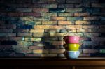 Colorful Tiffin Carrier On Wooden Cupboard Stock Photo