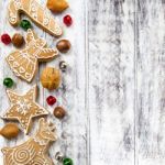 Christmas Gingerbread Cookies On White Table Stock Photo