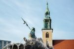 View Of The Neptune  Fountain With Marienkirche In The Backgroun Stock Photo