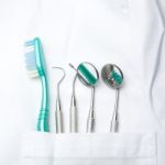 dental tools in dentist pocket Stock Photo