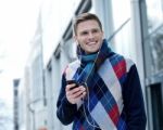 Guy Enjoying Music On Street Stock Photo