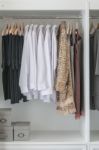 Pants, Shirts And Dress Hanging Stock Photo